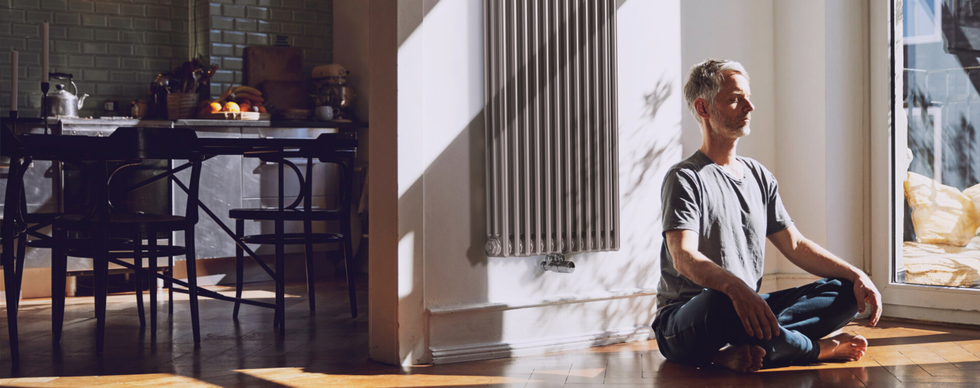 man meditates, old building flat, relaxed, charleston