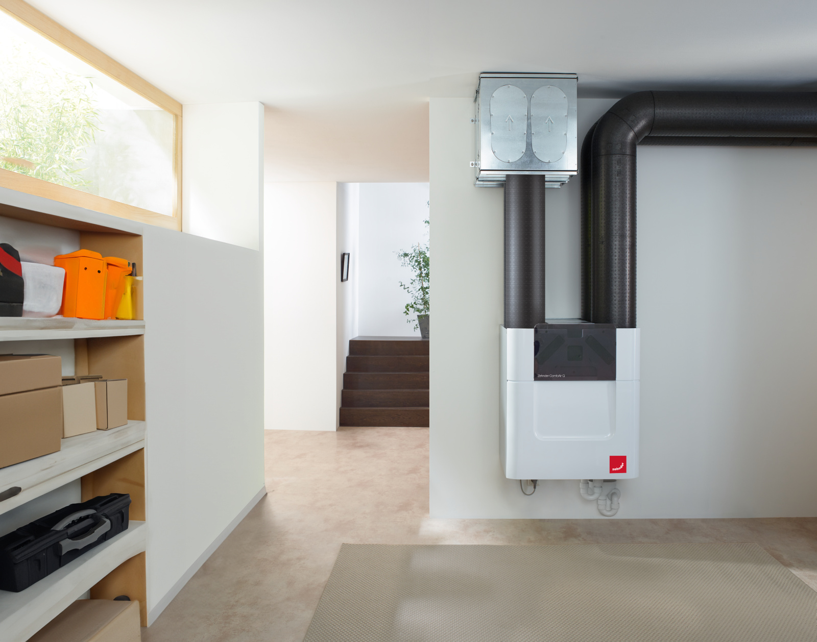Fresh Air Throughout the Home Compact Zehnder ventilation unit with ductwork installed in a home hallway