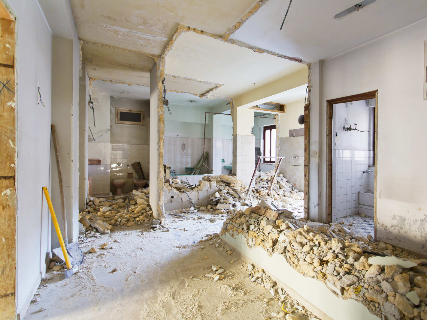 Comprehensive Renovation Site Preparation Stripped interior and structural work during a comprehensive home refurbishment project